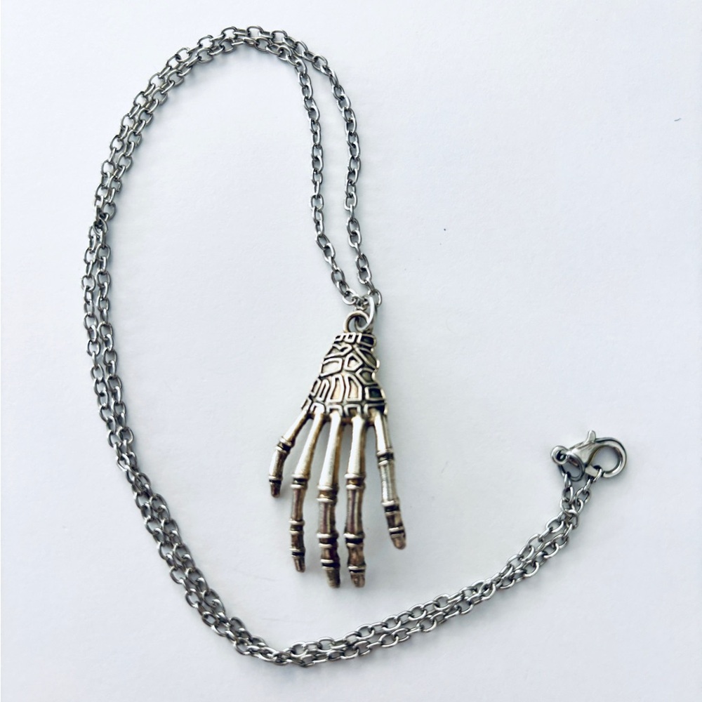 Victorian style macabre skeleton hand pendant necklace, NWT